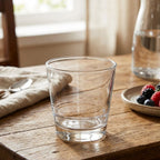 Clear glass on a wooden table with a blurred background