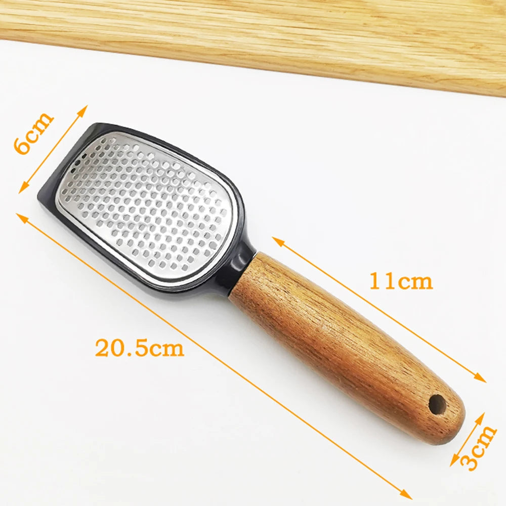 Grater with wooden handle and measurements on a white background