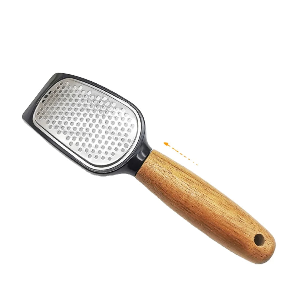 Grater with metal surface and wooden handle on a white background