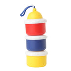 Stack of colorful containers with a blue handle on a white background
